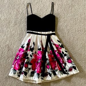 Beautiful dress with black silk belt stitched to the waist